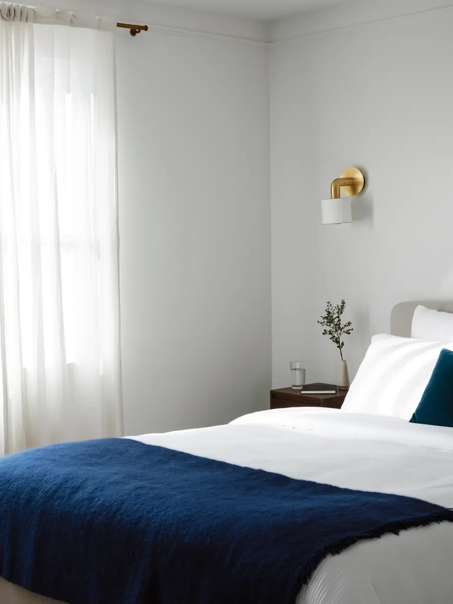 A calm bedroom in soft dawn light